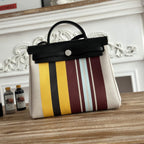 HERBAG ZIP 31 LAQUERED BAG IN BROWN MIX YELLOW H PLUME CANVAS